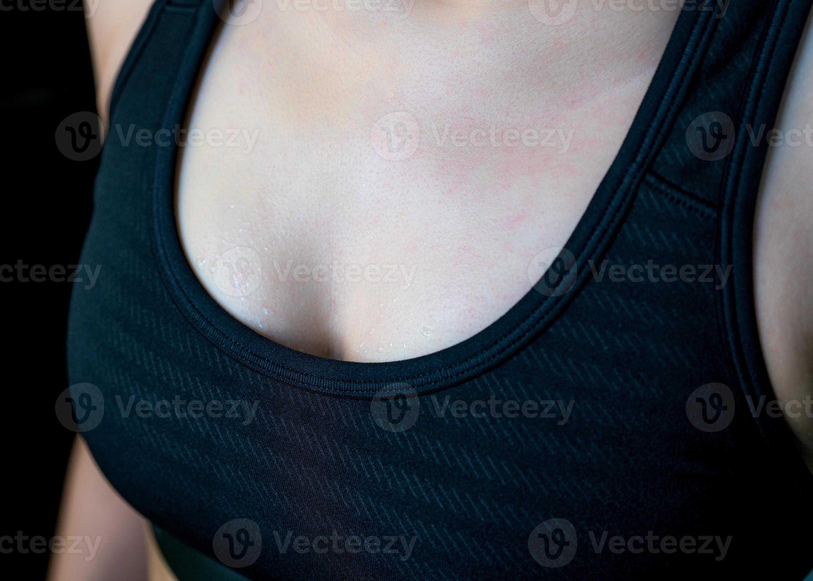 Sweat on woman chest after heavy cardio workout and weight