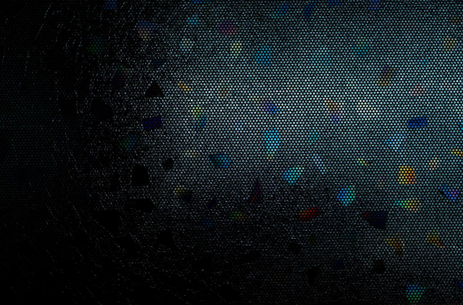 Stained glass mosaic abstract background. Stained glass window texture. Pattern of irregular glass on dark background. Art work for interior design. Craft material. Blue, purple and orange glass. photo