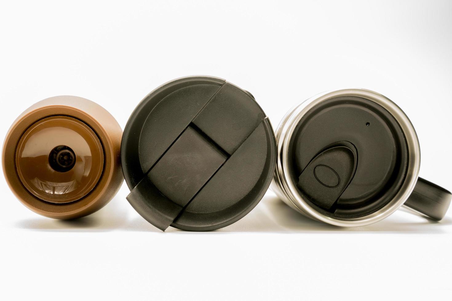 3 type of lid of thermos bottle on white background. Coffee, tea, and warm water bottle. Black and brown lid of coffee and tea bottle. Insulated bottle. Travel thermos tumbler. photo
