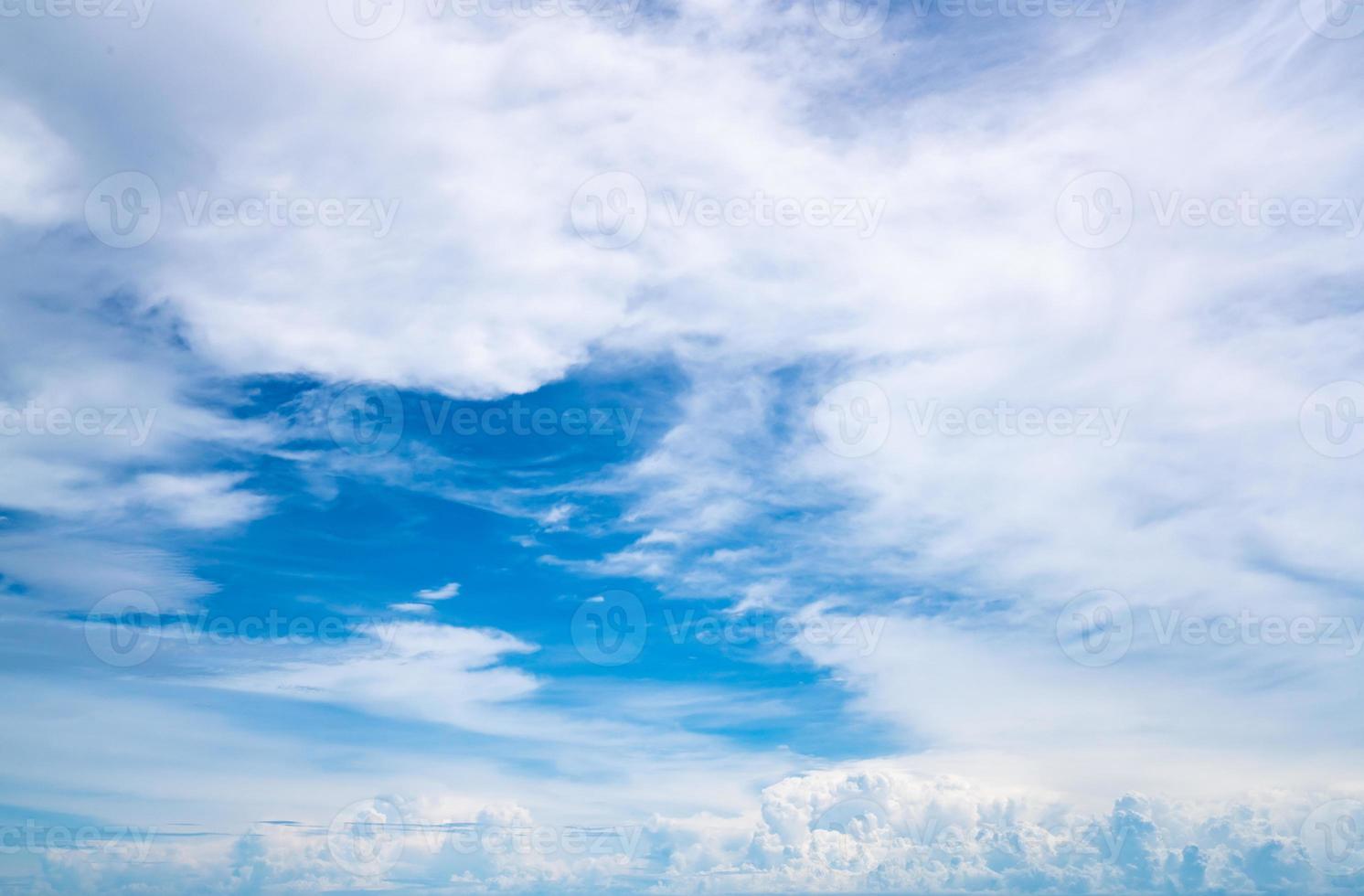 White fluffy clouds on blue sky. Soft touch feeling like cotton. White puffy clouds cape with space for text. Beauty in nature. Close-up white cumulus clouds texture background. Sky on sunny day. photo
