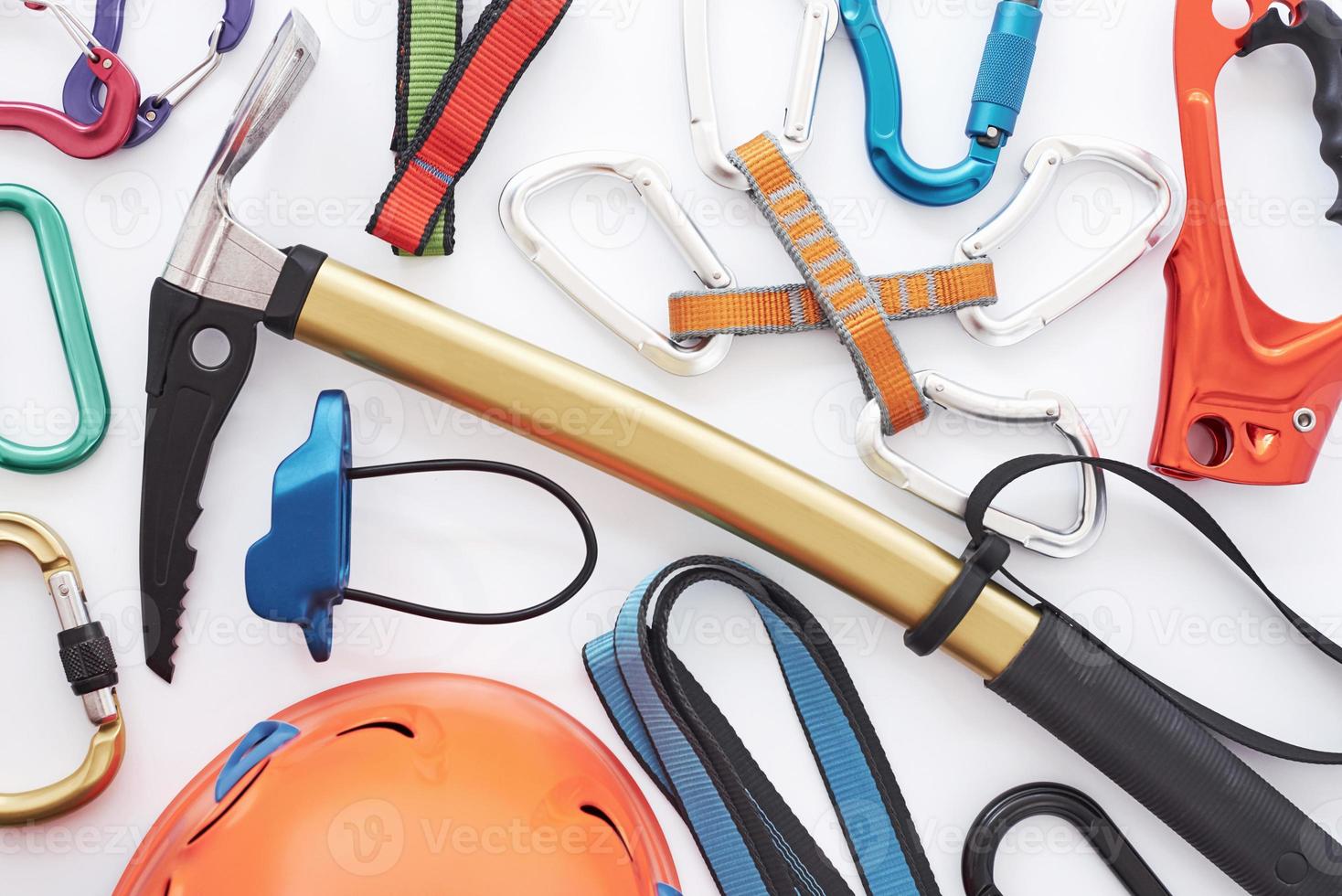 All you need. Top view. Climbing equipment for the safeness lying on the white table. Conception of extreme sports photo