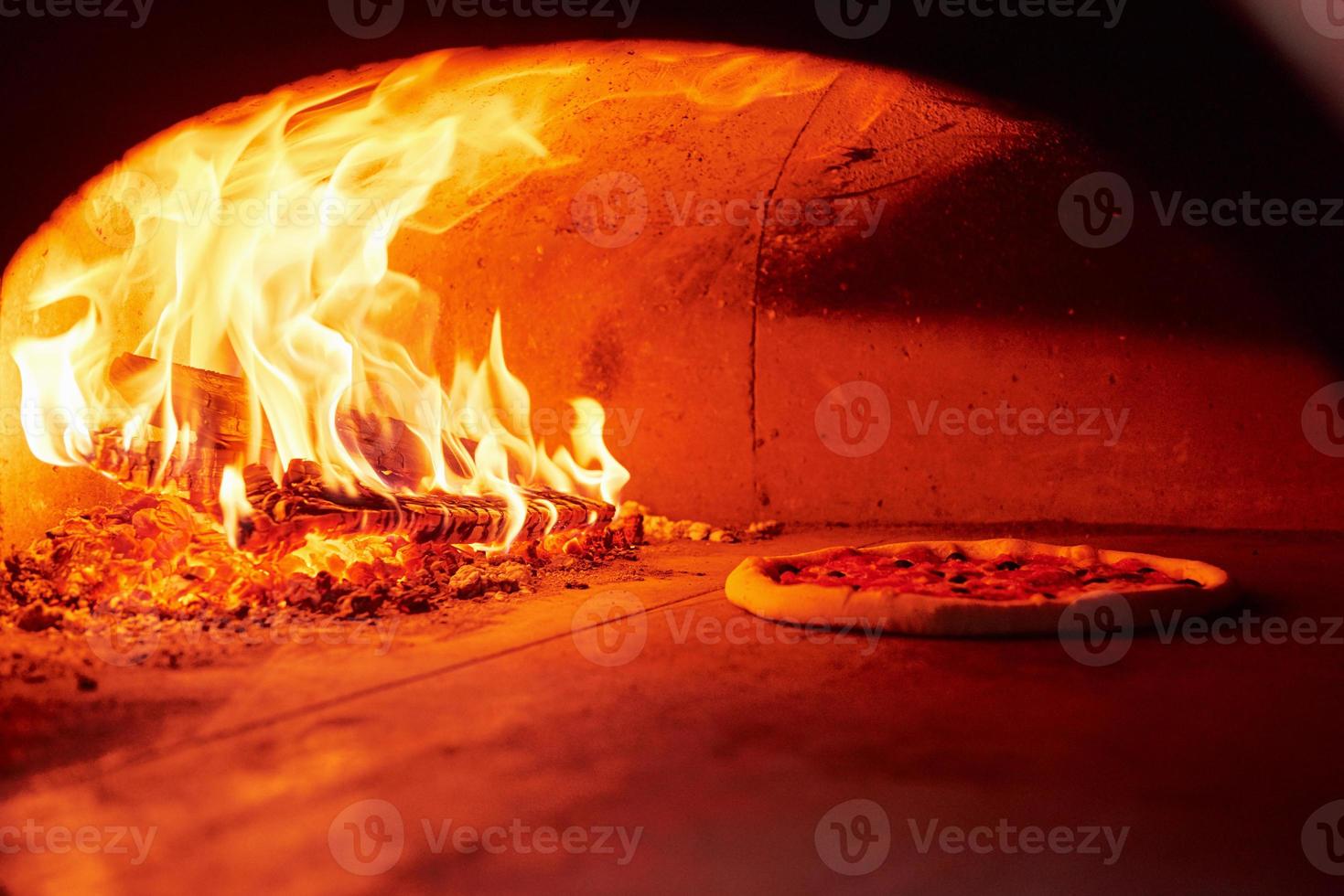 Process of cooking. Fire burning in the furnace. Close up view of wood in flames photo