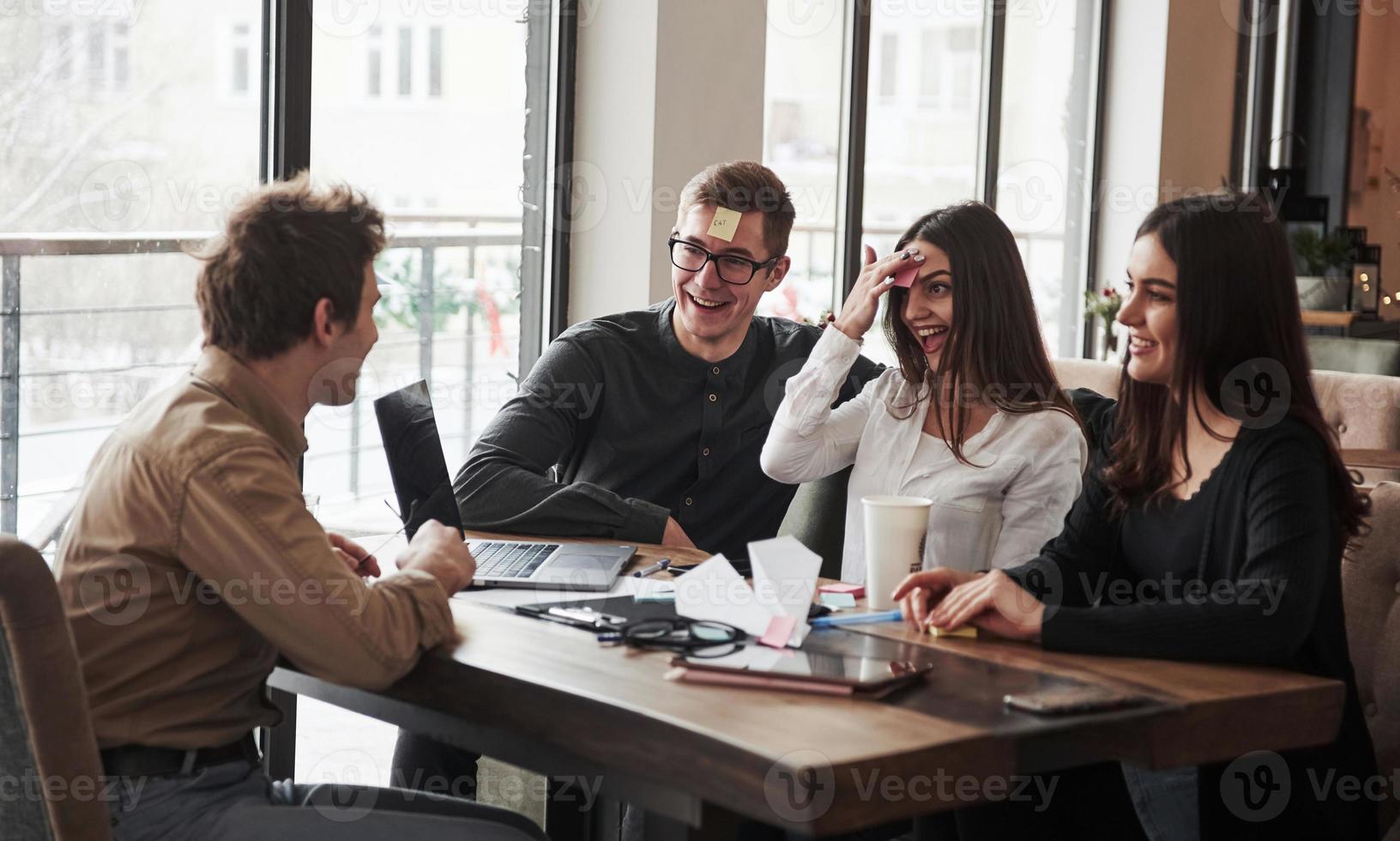 Relaxing mindful games. Having fun in the office room. Friendly coworkers playing around at their break time photo