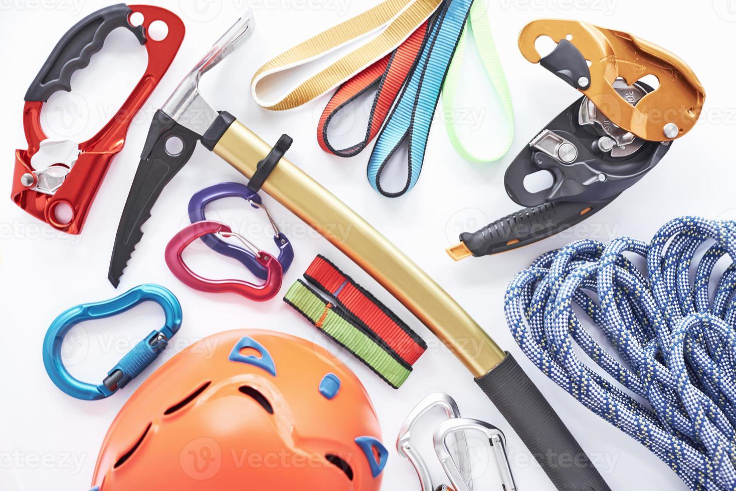 Must have things. Top view. Climbing equipment for the safeness lying on the white table. Conception of extreme sports photo