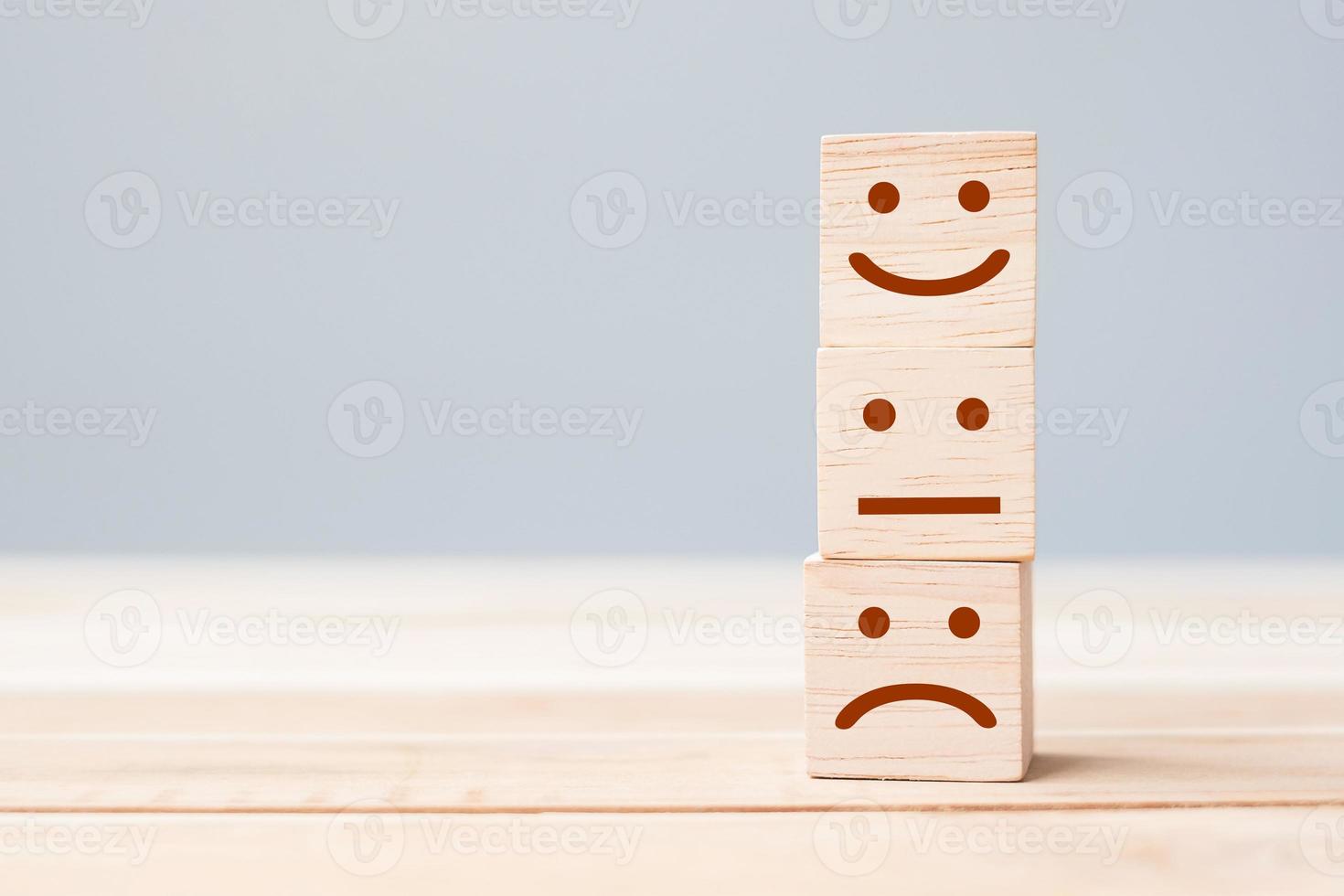 smile face symbol on yellow wooden cube blocks. Emotion, Service rating, ranking, customer review, satisfaction and feedback concept photo