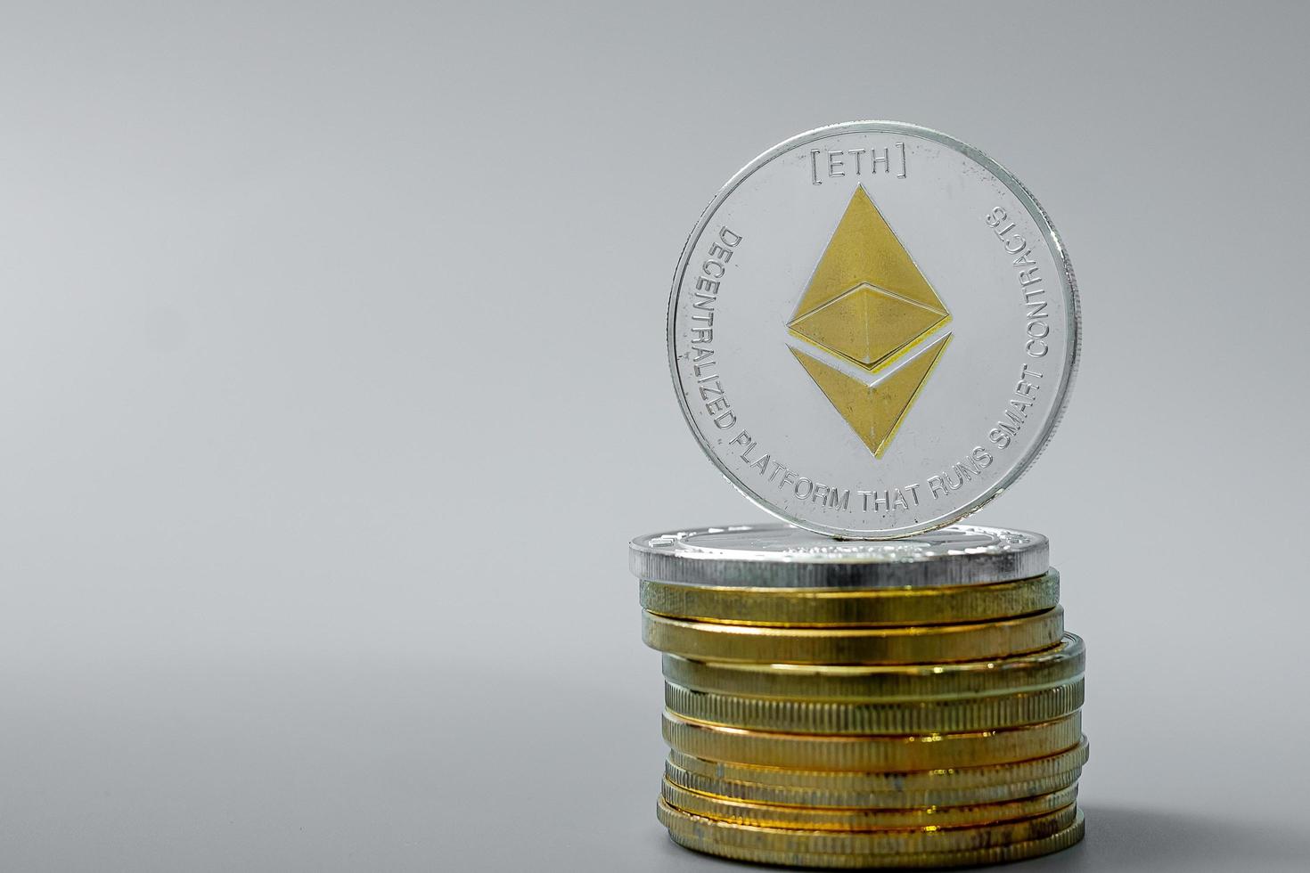 Silver Ethereum cryptocurrency coin stack, Crypto is Digital Money within the blockchain network, is exchanged using technology and online internet exchange. Financial concept photo