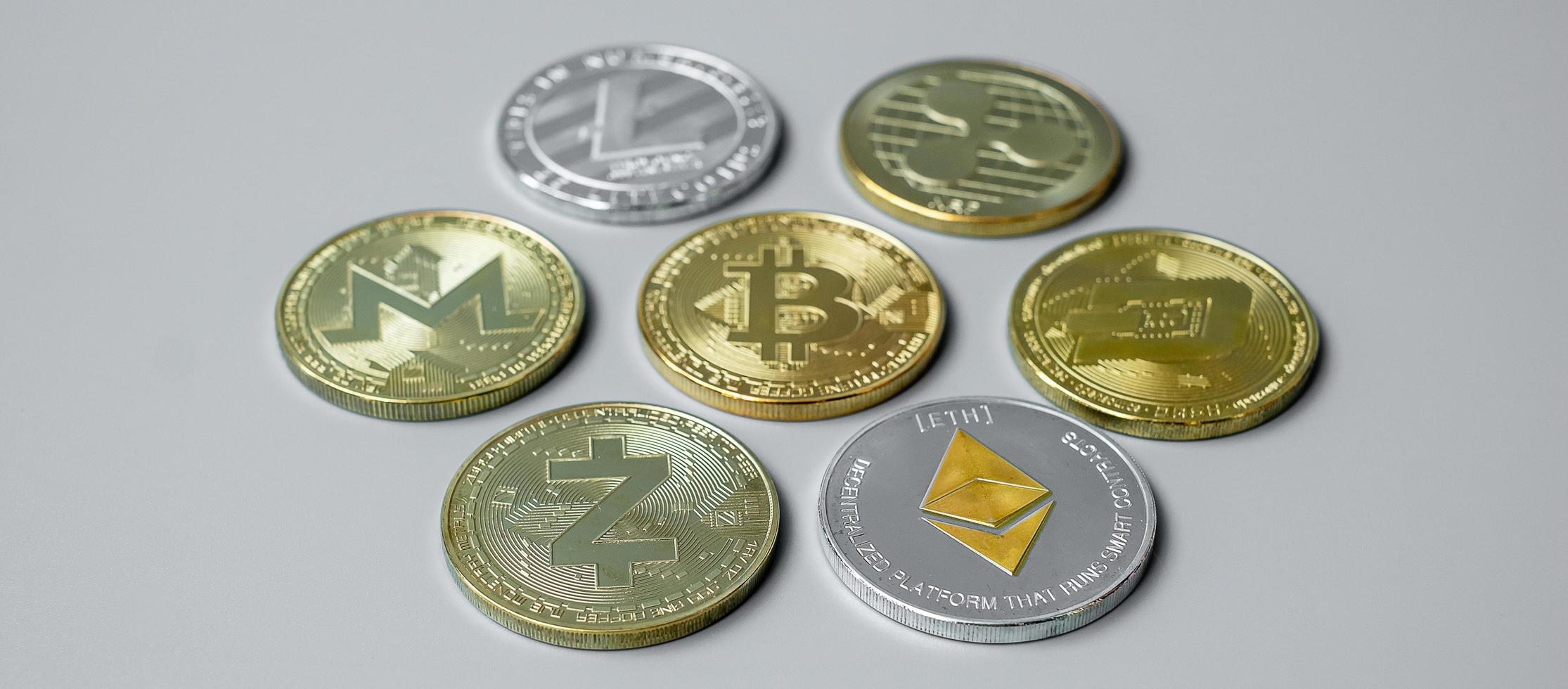 golden and silver Cryptocurrency, Bitcoin, Ethereum, Litecoin, Dash, Monero, Zcach and Ripple coins. Crypto is Digital Money within the blockchain network photo