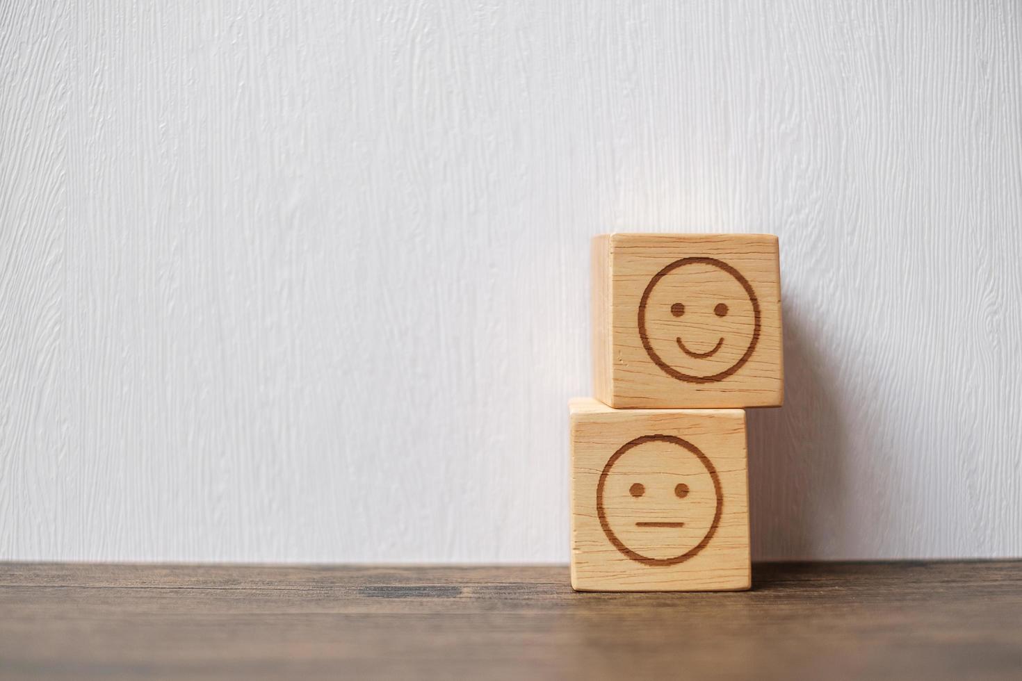 emotion face symbol on wooden blocks. mood, Service rating, ranking, customer review, satisfaction, evaluation and feedback concept photo