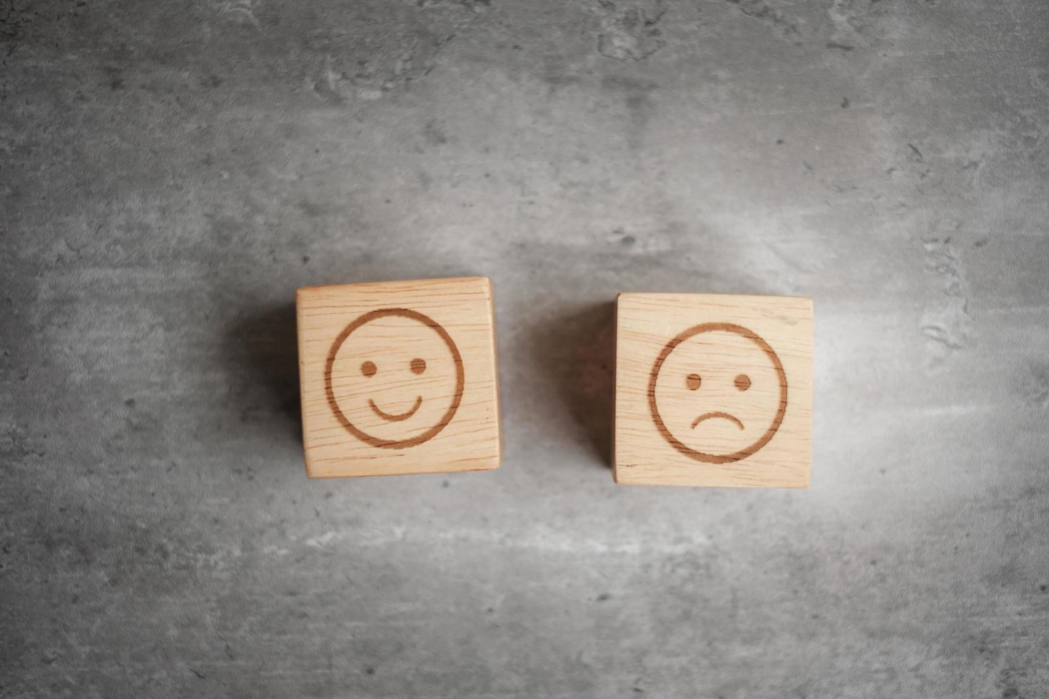 emotion face symbol on wooden blocks. mood, Service rating, ranking, customer review, satisfaction, evaluation and feedback concept photo