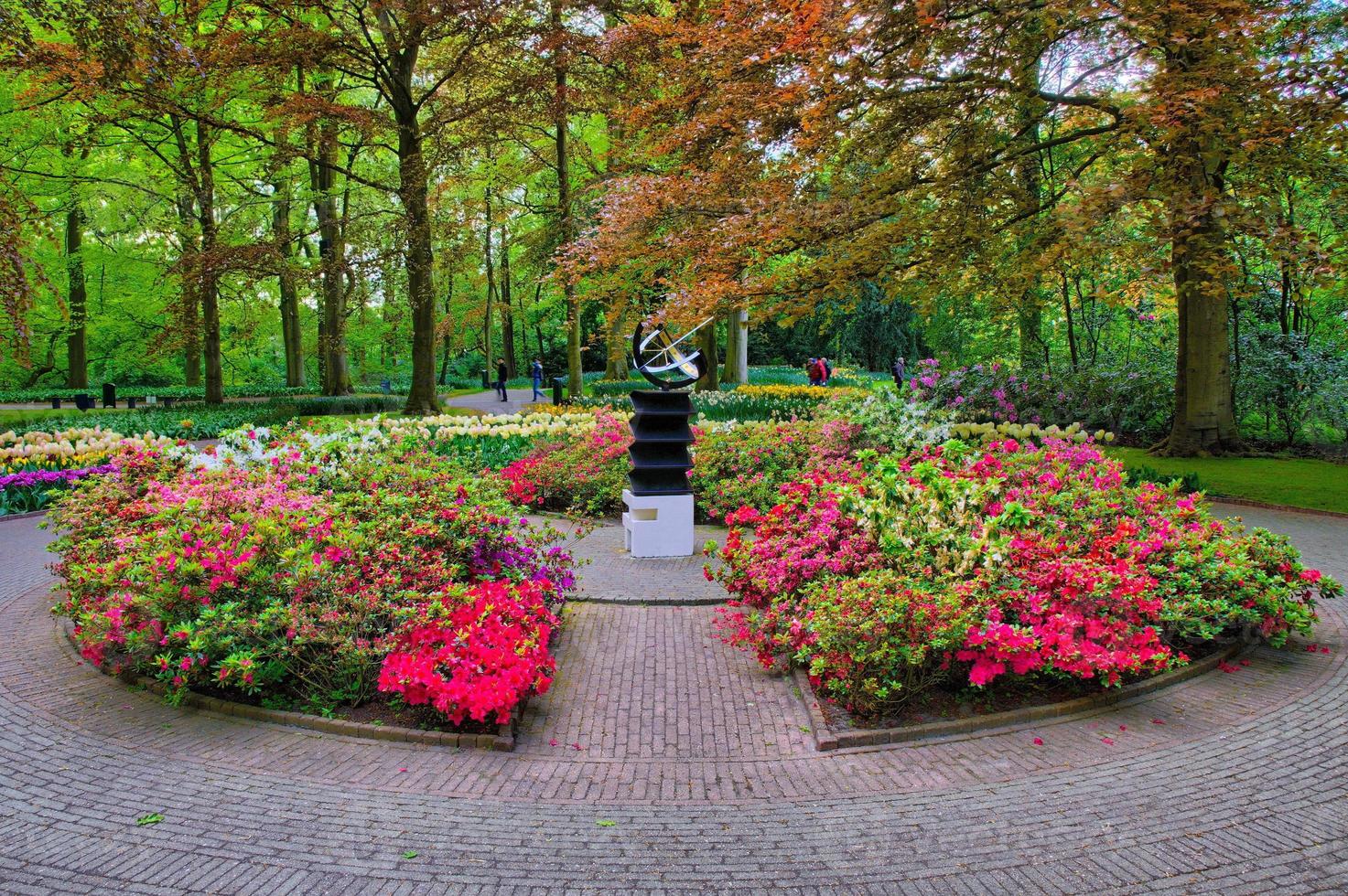 Monument among pink flowers, Keukenhof Park, Lisse in Holland photo