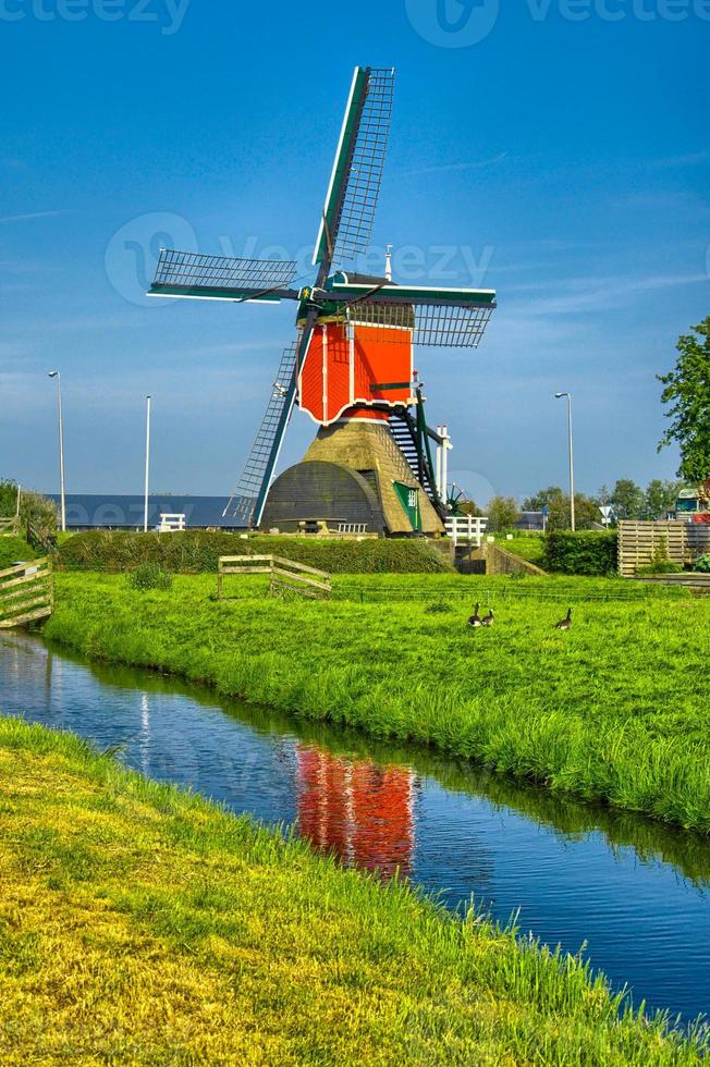 Windmills and water canal in Kinderdijk, Holland or Netherlands. photo