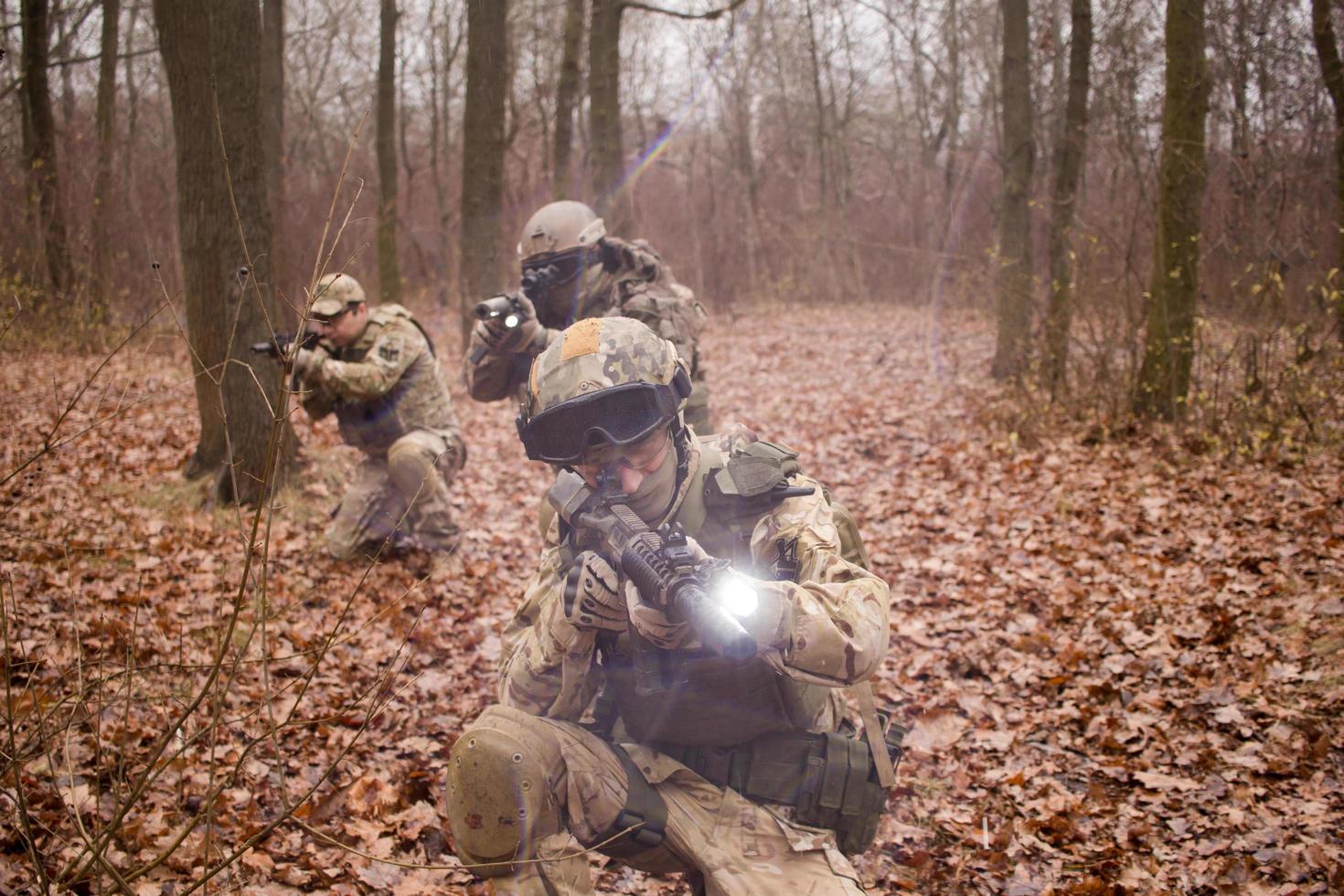 soldiers in the autumn forest photo