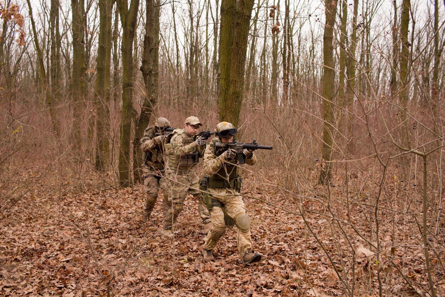 soldiers in the autumn forest photo