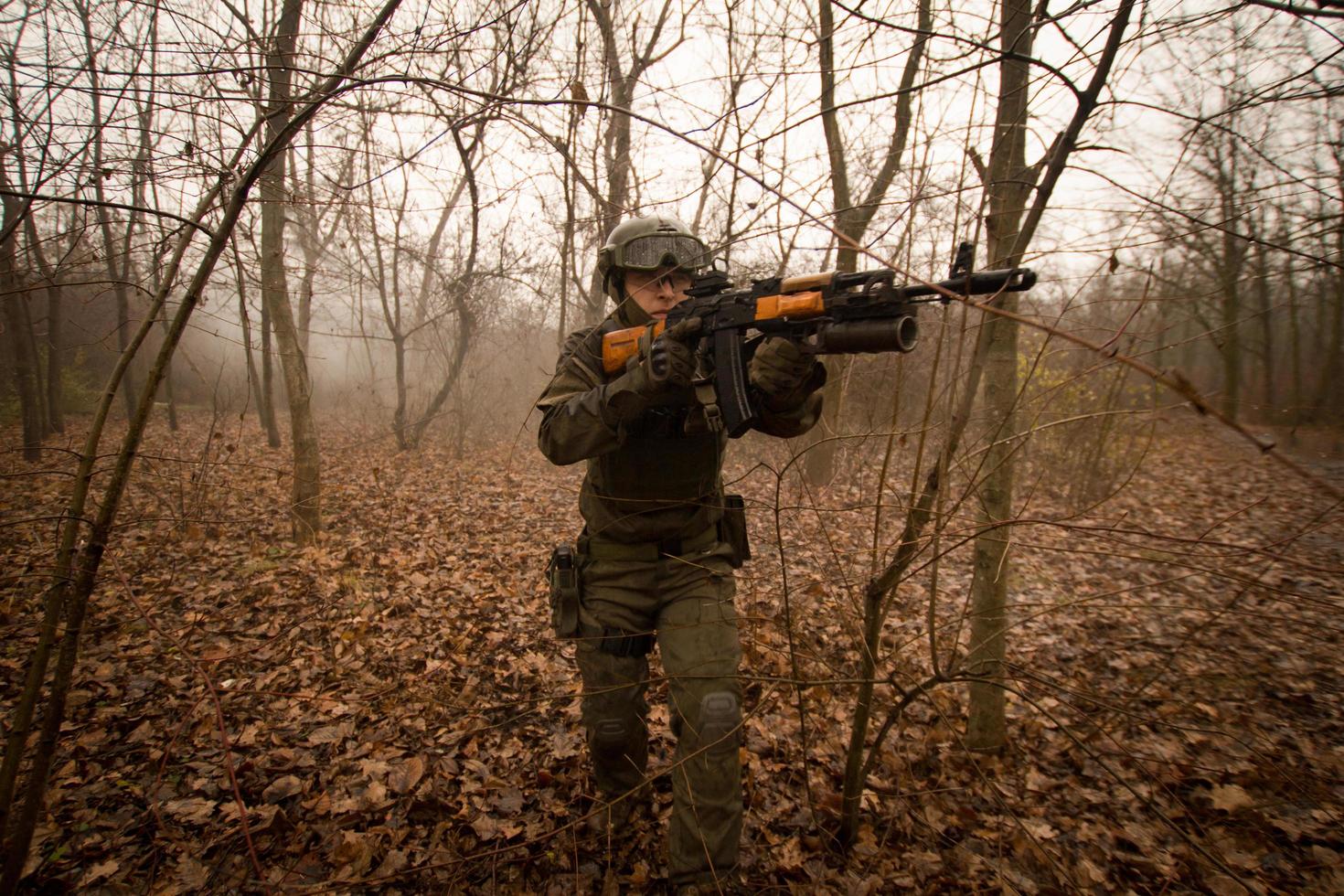 soldiers in the autumn forest photo