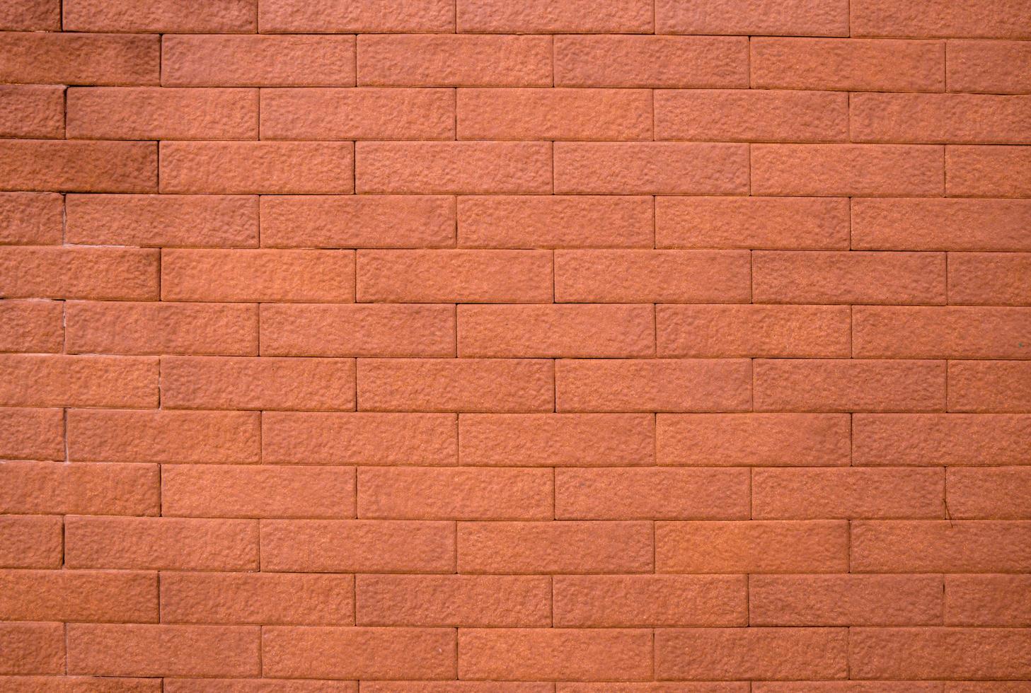 Fondo de textura de pared de ladrillo naranja con espacio para texto foto