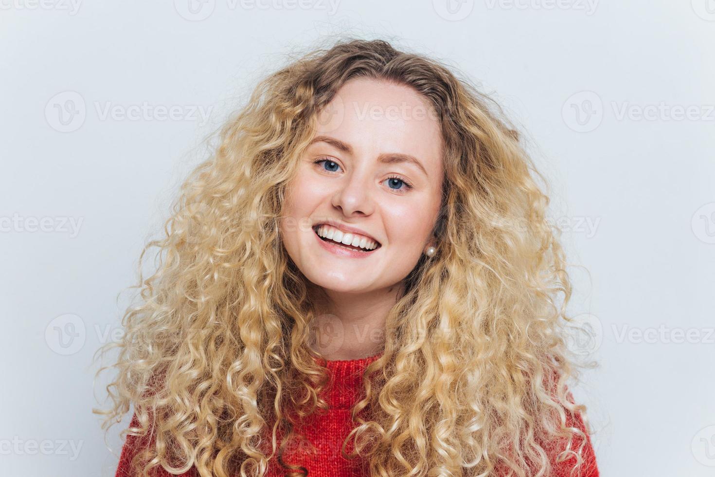 Premium Photo  Pretty cheerful woman with curly hair talks about