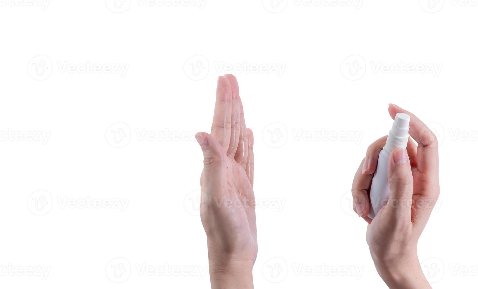 Woman hand hold alcohol bottle and spray on palm to protect and kill coronavirus and cleaning hand. Personal hygiene to prevent coronavirus or flu epidemic. Cleaning hands from germs, virus, bacteria. photo