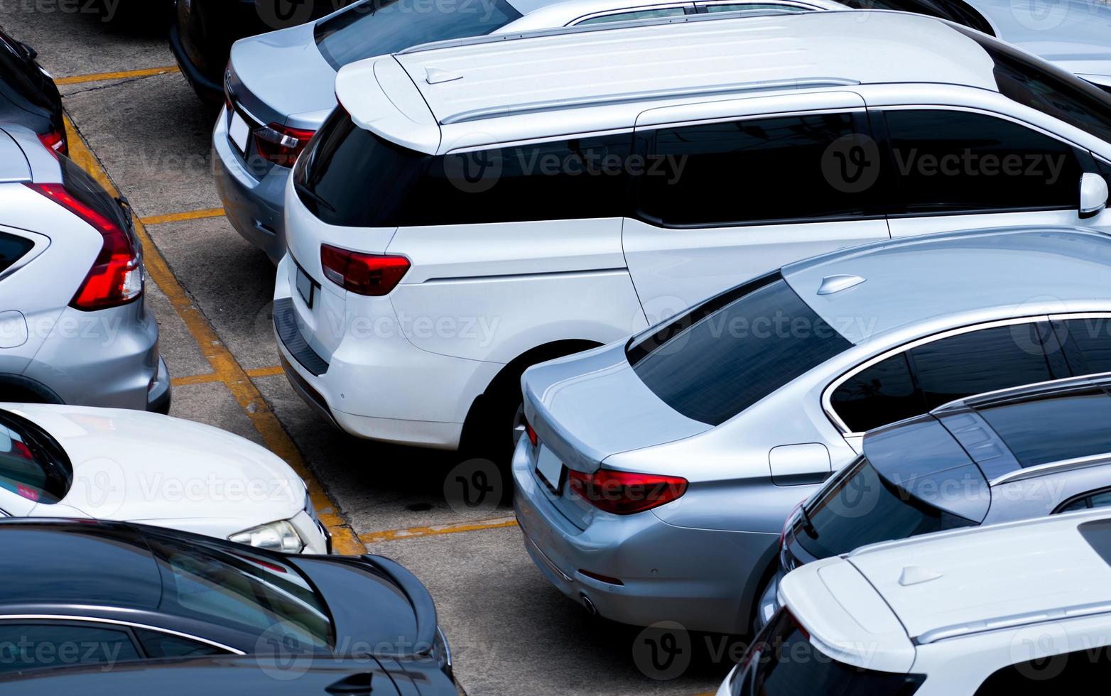 Car parked at parking lot of the airport for rental. Aerial view of car parking lot of the airport. Used luxury car for sale and rental service. Automobile parking space. Car dealership concept. photo