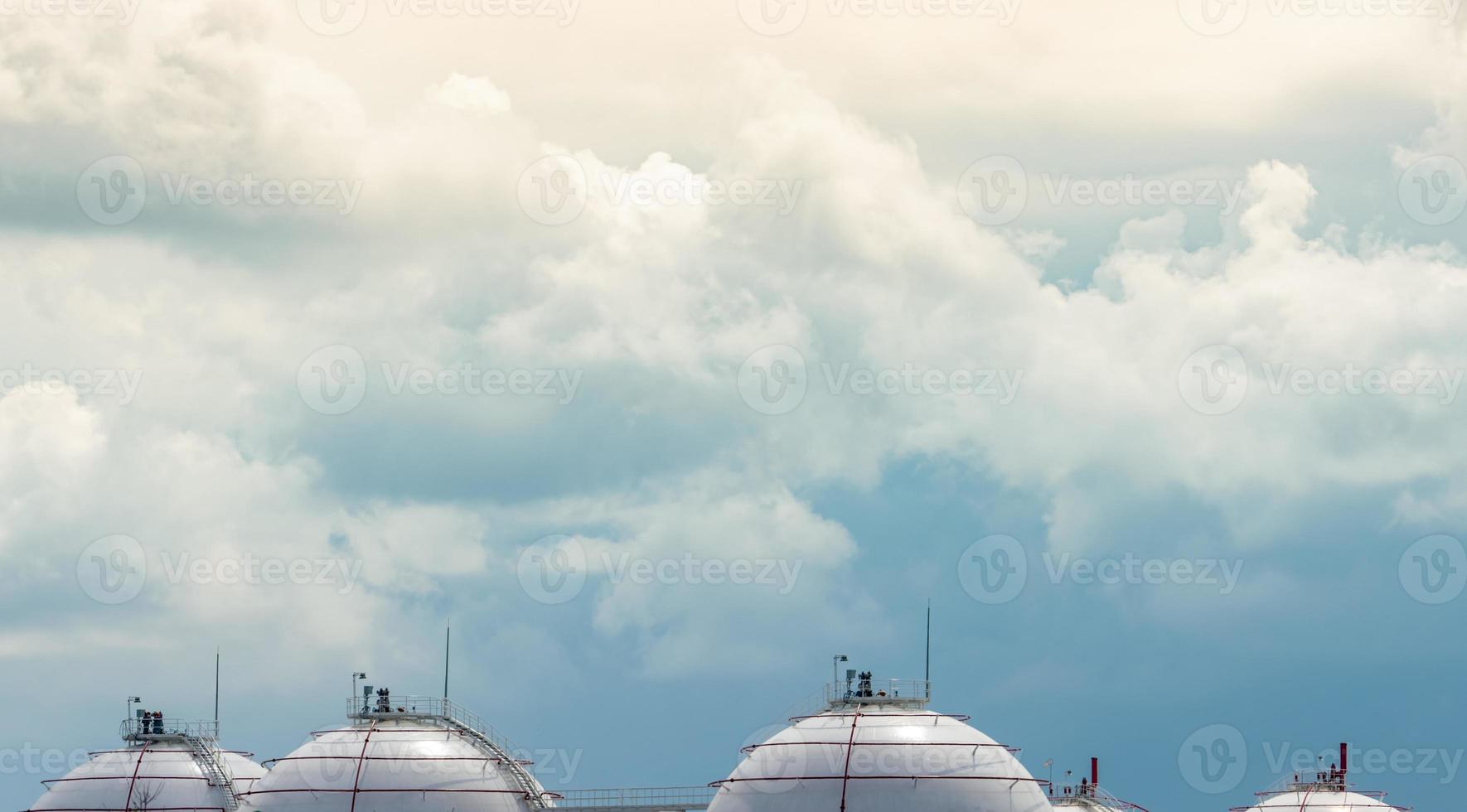 Industrial gas storage tank. LNG or liquefied natural gas storage tank. Spherical gas tank in petroleum refinery. Above-ground storage tank. Natural gas storage industry and global market consumption photo