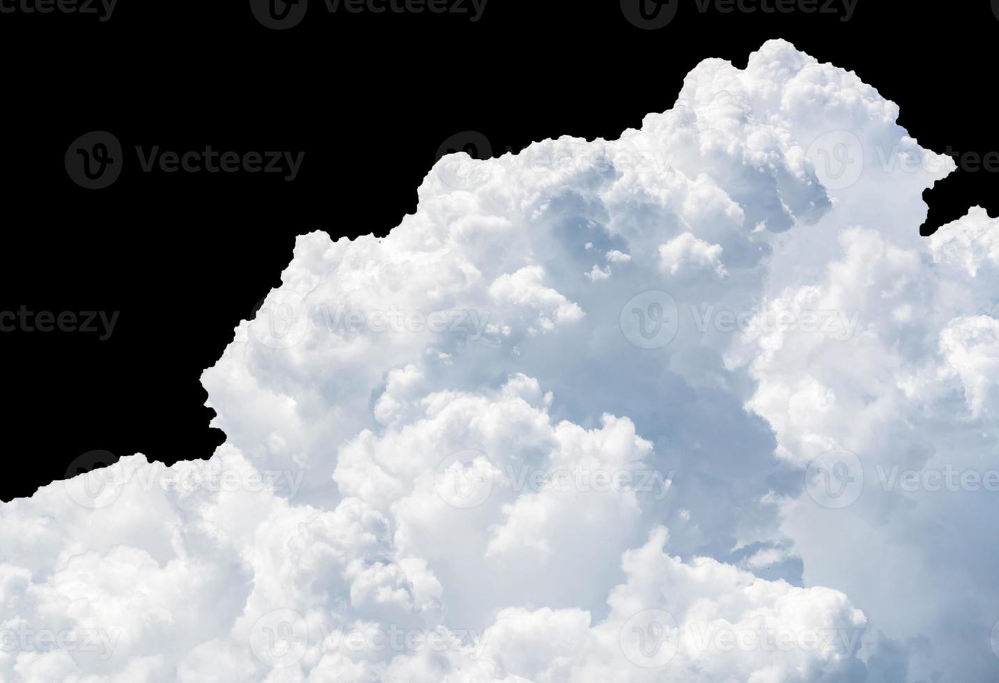 Pure white cumulus clouds on black background. Cloudscape background. White fluffy clouds on dark background. Soft cotton feel of white clouds texture isolated on black background. Soft touch clouds. photo