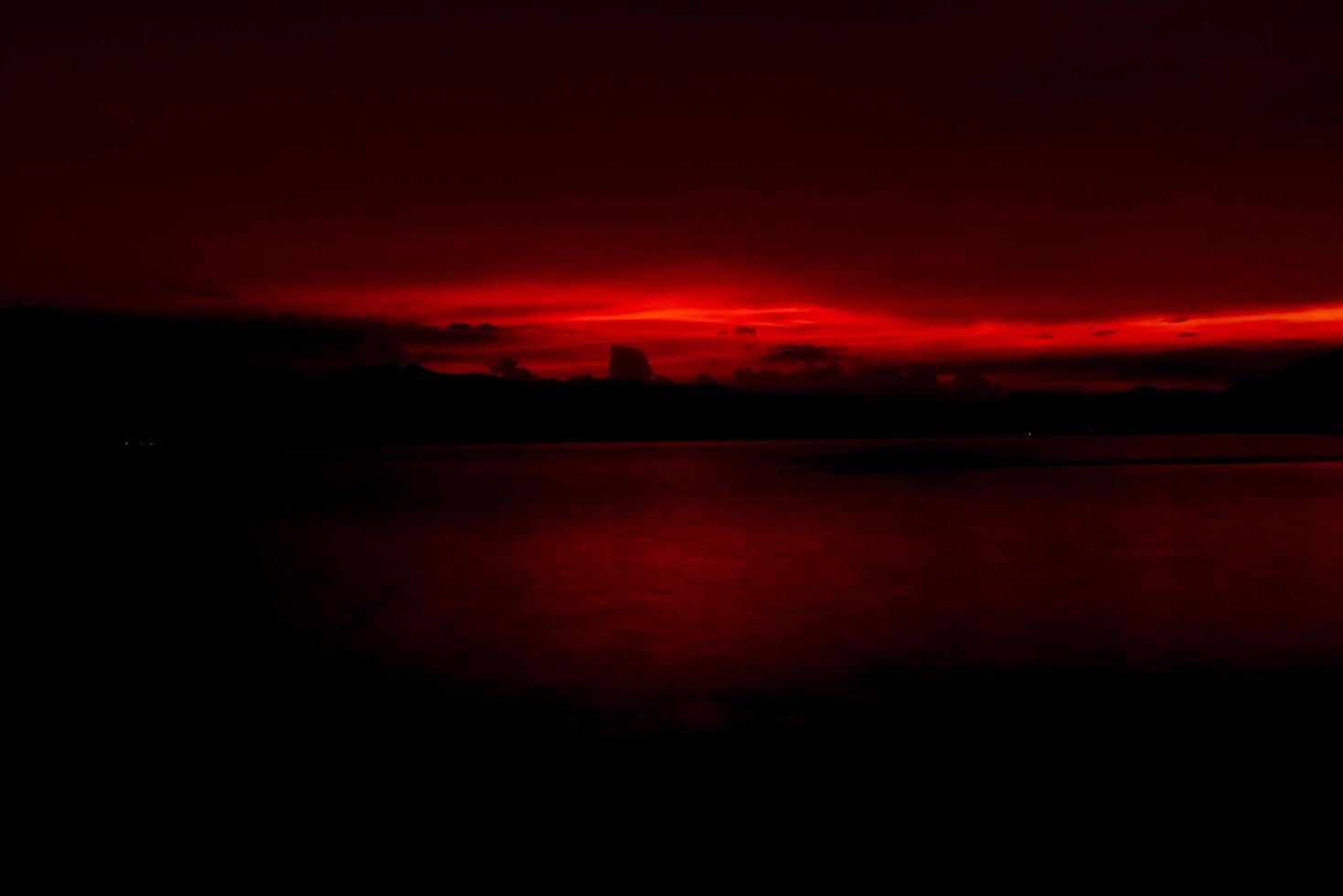 Red and orange sunset sky at the mountain and lake. Beautiful evening sky. Majestic sunset sky. Nature background. Art picture of sky at dusk. Sunset abstract background. Dusk and dawn concept photo