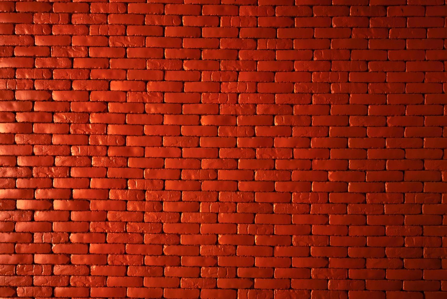 Orange brick wall texture background. Brickwork for home architecture interior. Loft design of home. Red brick wall vintage background. Masonry work. Home construction. Brick wall pattern. Empty wall. photo