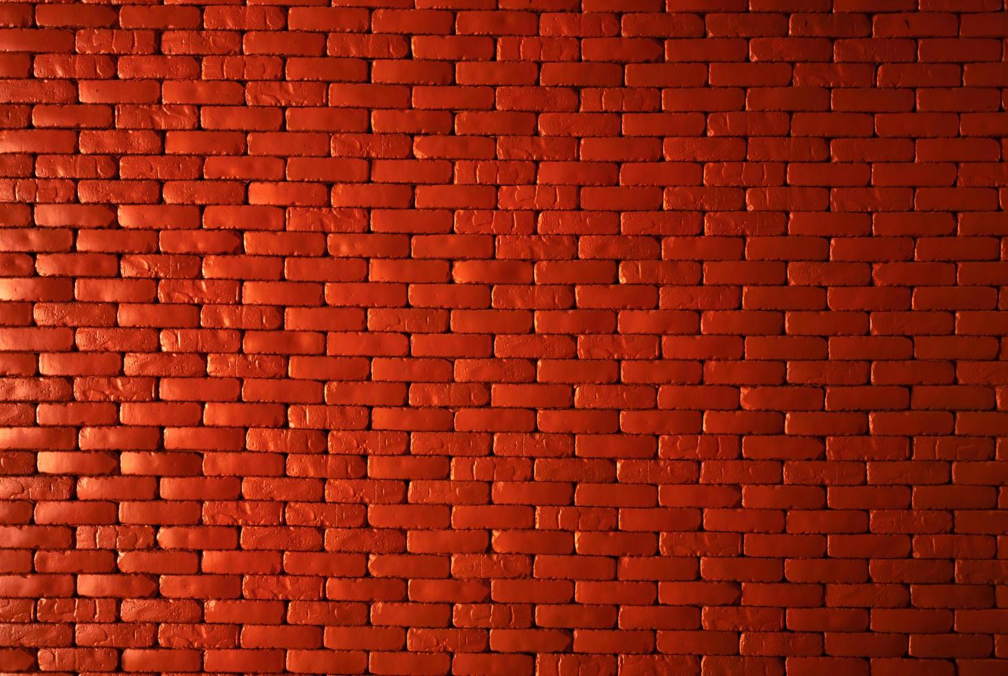 Orange brick wall texture background. Brickwork for home architecture interior. Loft design of home. Red brick wall vintage background. Masonry work. Home construction. Brick wall pattern. Empty wall. photo