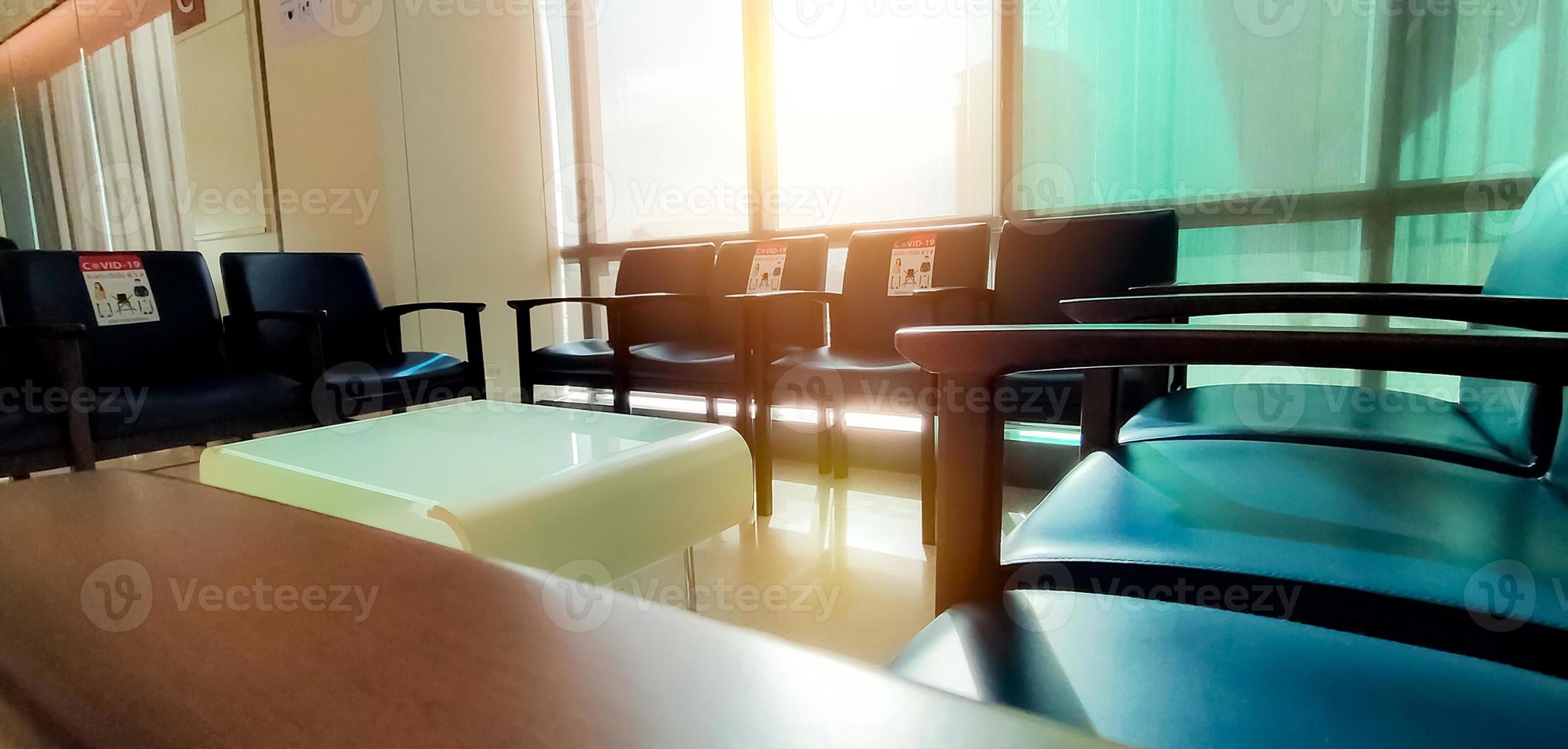 Social distancing. Empty dark blue chair with gap for social distance to prevent coronavirus COVID-19 at waiting room in office for waiting queue. Public chair for social distancing in new normal. photo