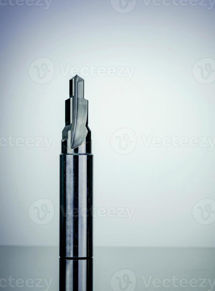 Special tools isolated on white texture background. Made to order special tools. Sharp reamer detail. HSS cemented carbide. Carbide cutting tool for industrial applications. Engineering tools on dark. photo
