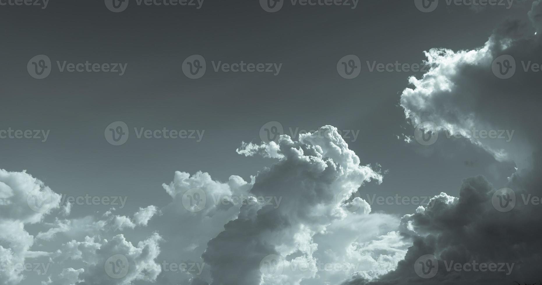 Dark dramatic sky and clouds. Background for death and sad concept. Gray sky and fluffy white clouds. Thunder and storm sky. Sad and moody sky. Nature background. Dead abstract background. Cloudscape. photo