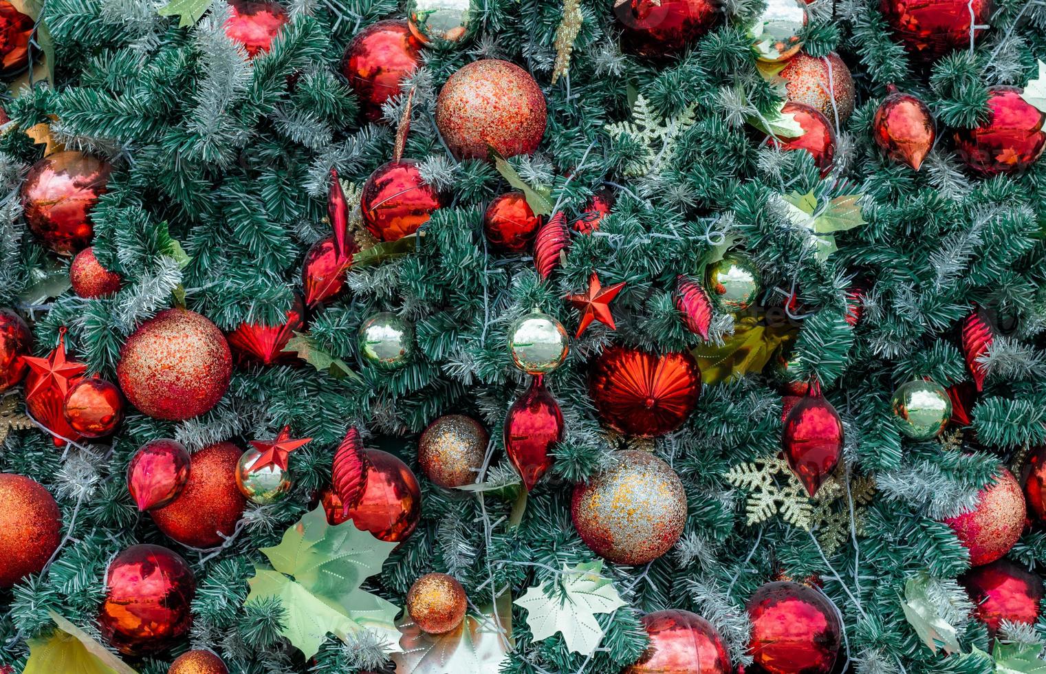 Close up Christmas tree decoration with red ball, gold ball, golden snowflake, red star. Xmas background. Christmas and Happy New Year holiday background. photo