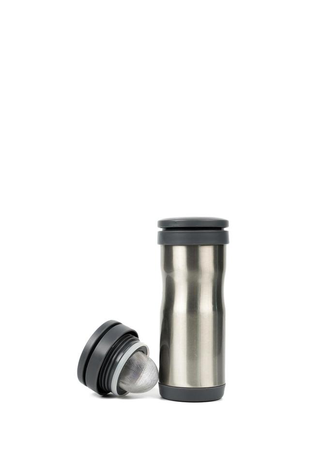 Thermos bottle isolated on white background. Coffee or tea reusable bottle container. Thermos travel tumbler. Insulated drink container. Stainless steel sport thermos water flask. Zero waste. photo