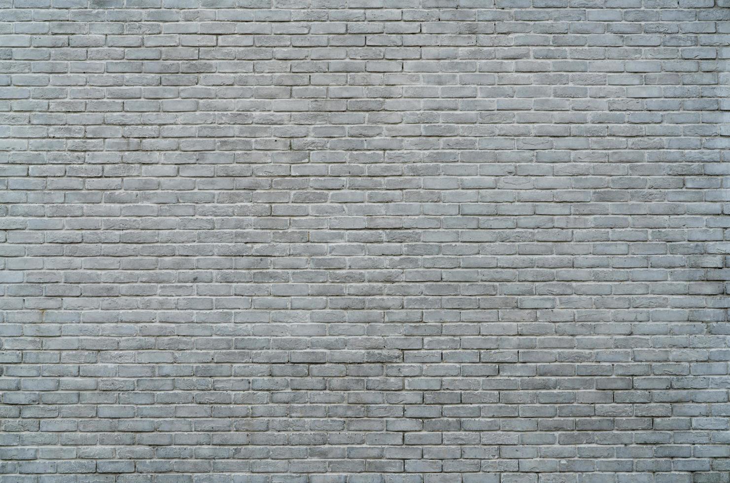 White and grey brick wall texture background with space for text. White