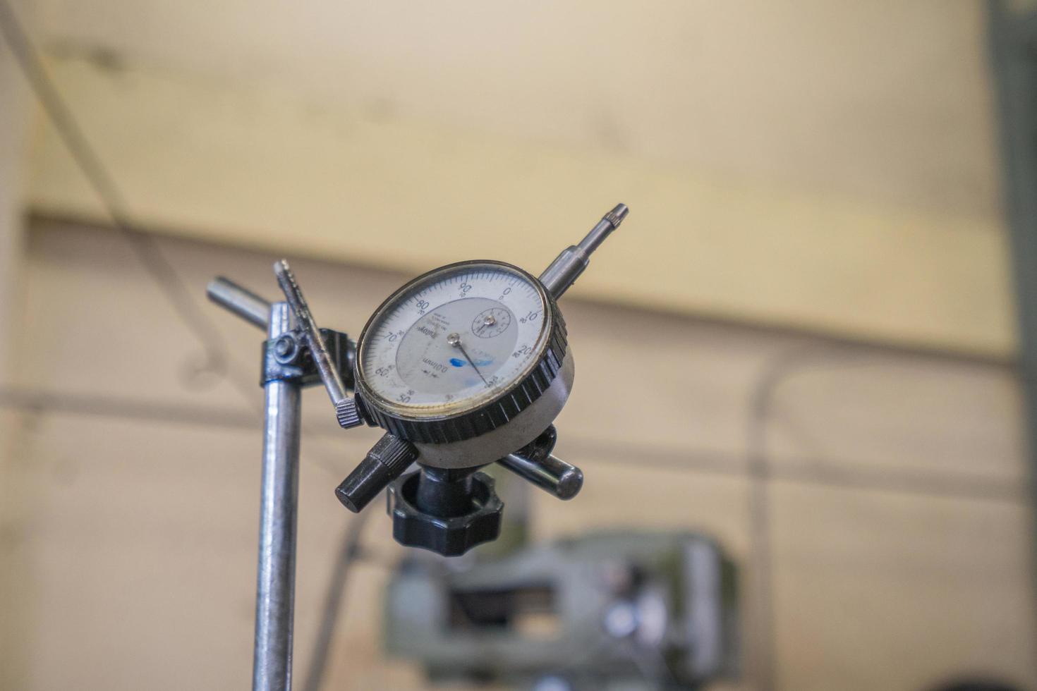 Dial indicator gauge. Standard dial gauge. Dial indicator. Measuring equipment. Measurement tool. Dial gauge for measure machine in factory industry. Processing tools. photo