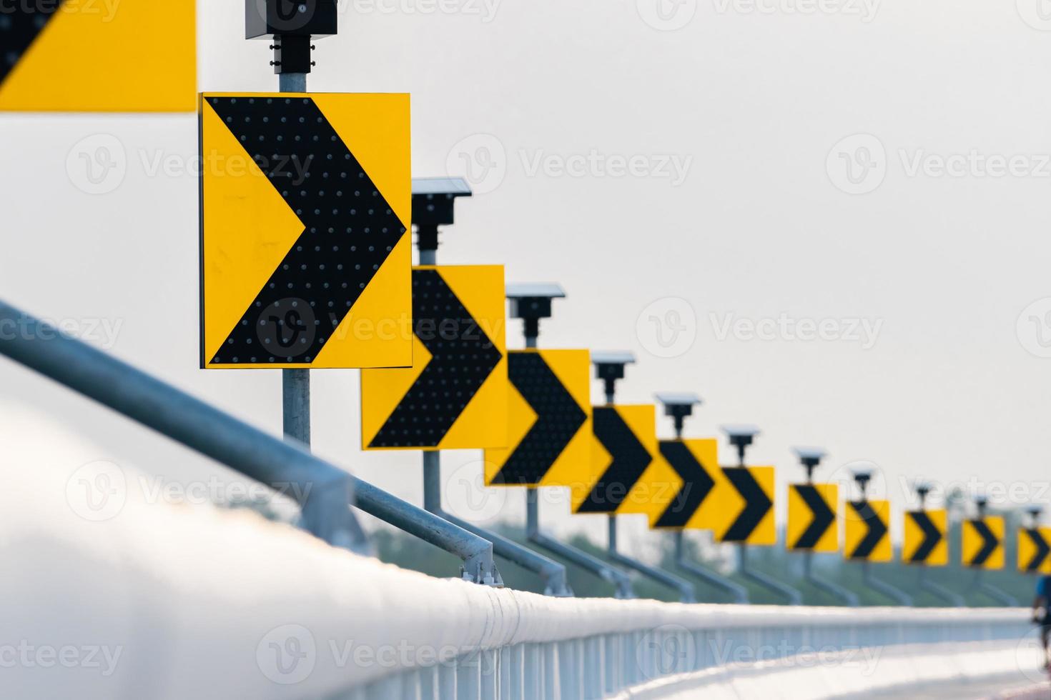 Traffic sign with solar cell panel power on white sky background. Electric pole with solar energy. Green energy concept. Renewal energy. Alternative electricity source. Sustainable resources photo