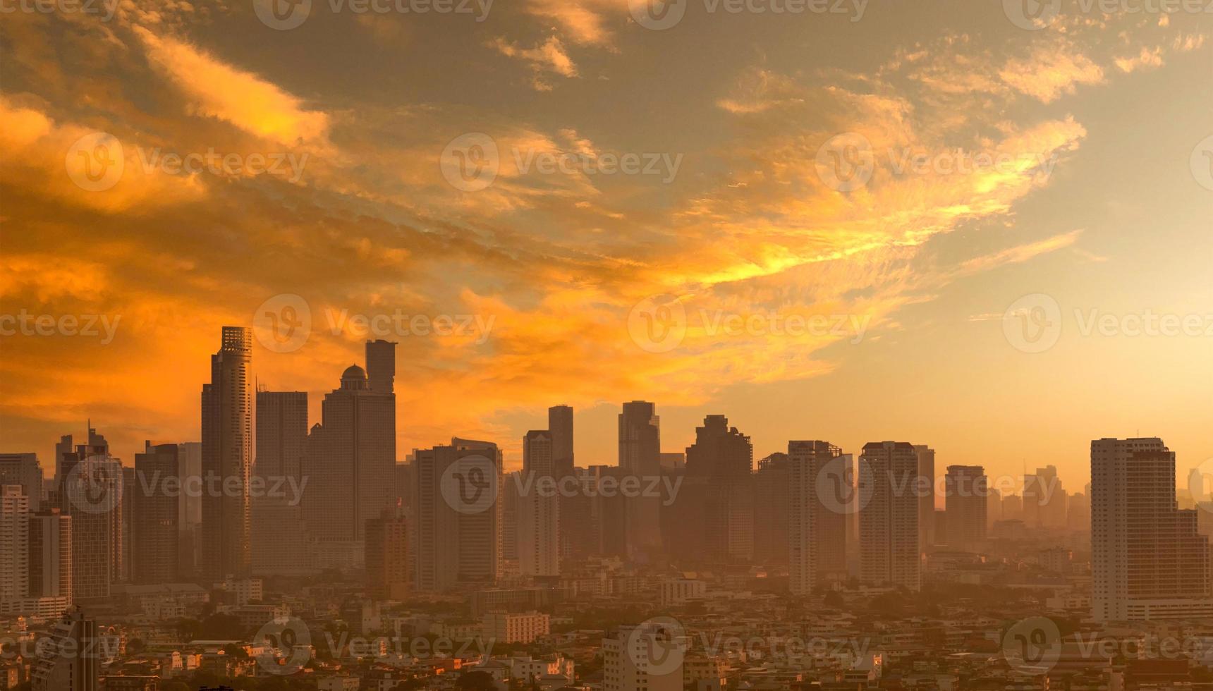 Air pollution. Smog and fine dust of pm2.5 covered city in the morning with orange sunrise sky. Cityscape with polluted air. Dirty environment. Urban toxic dust. Unhealthy air. Urban unhealthy living. photo