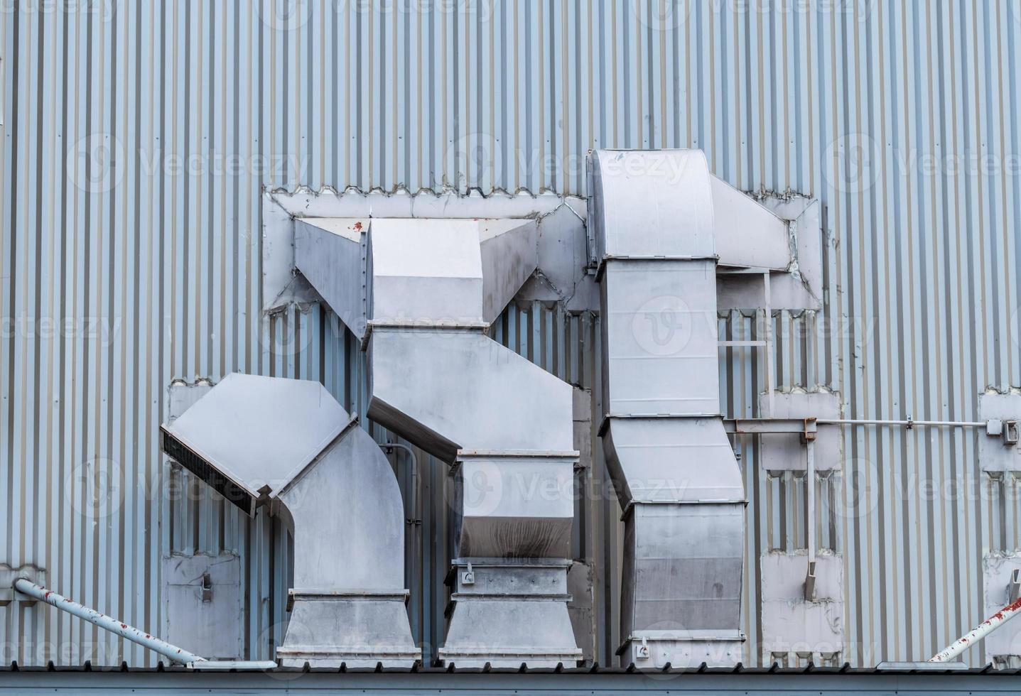 Exhaust air ventilation system. Air Handling Unit. Ventilation system of shopping mall. AHU. Exterior building pipe. Exhaust air system for clean and flow in building. Air pollution, PM 2.5 concept. photo