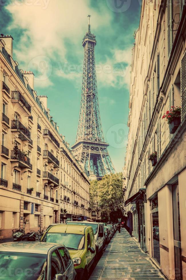 Eiffel Tower seen from the street in Paris, France. Vintage photo