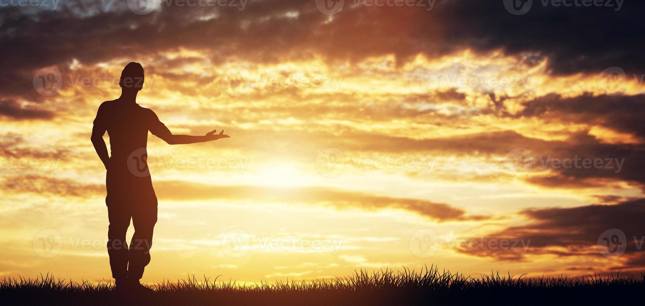 Casual man standing in front of the sky pointing right photo