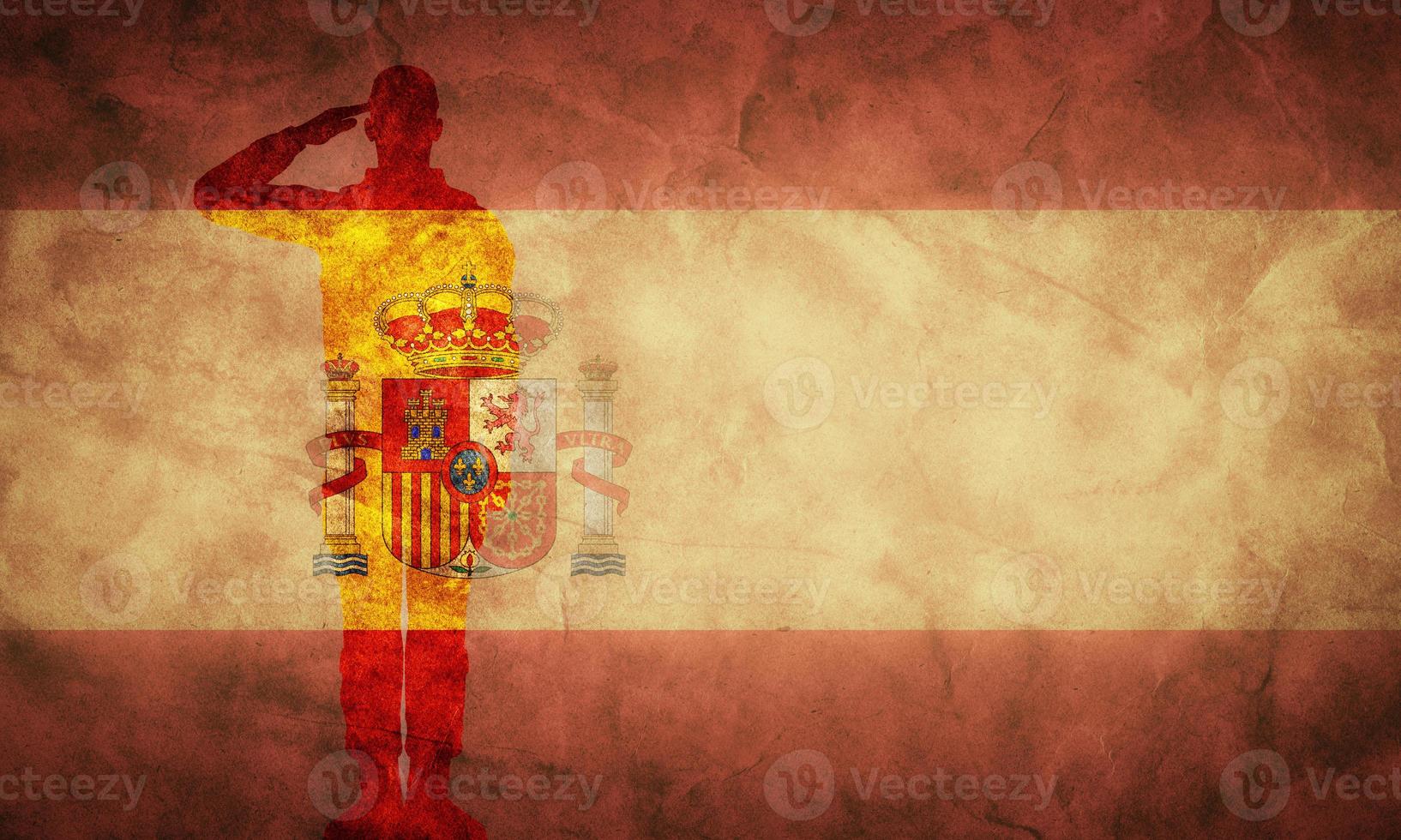 Spanish grunge flag with soldier silhouette. photo