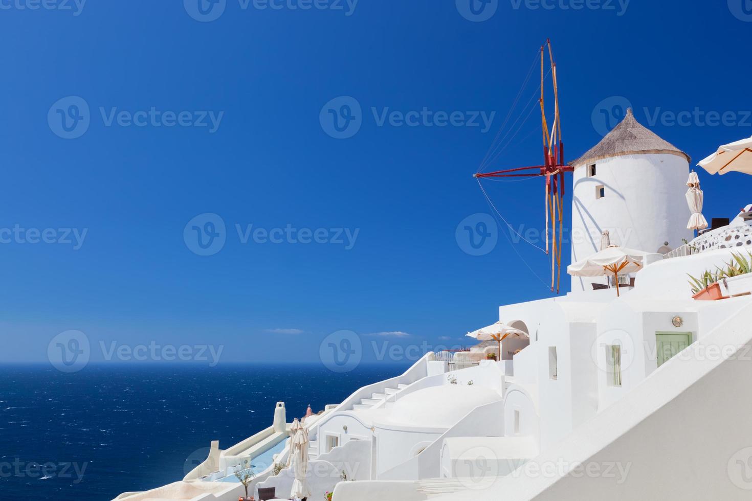 Oia town on Santorini island, Greece.  Famous windmills photo