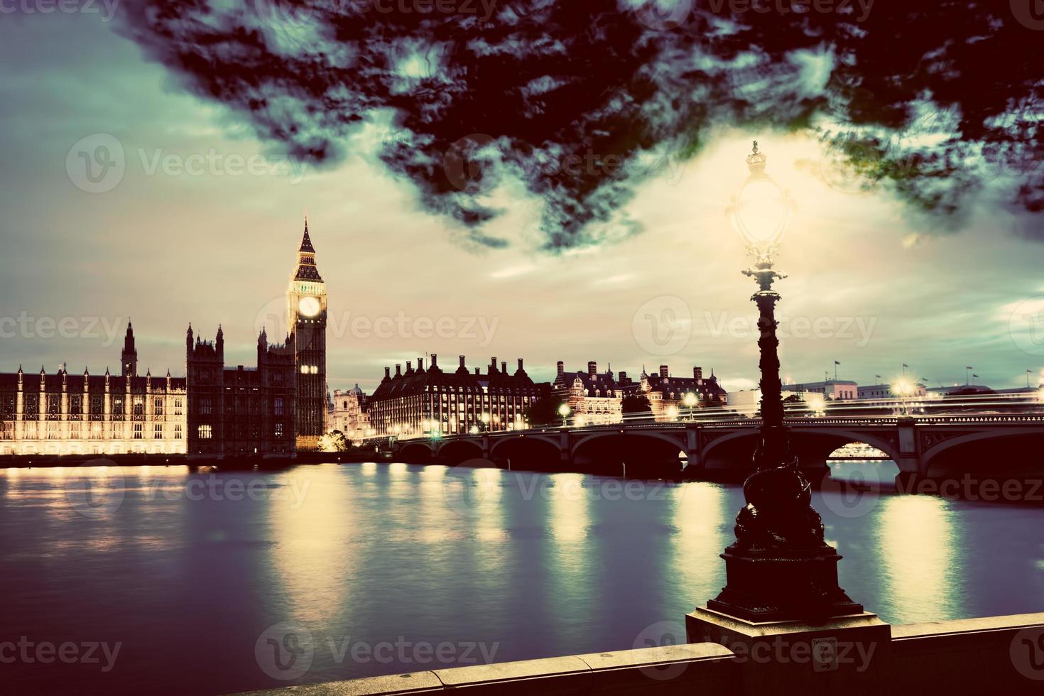 Big Ben, London the UK at sunset. Retro street lamp light on Westminster Bridge. Vintage photo