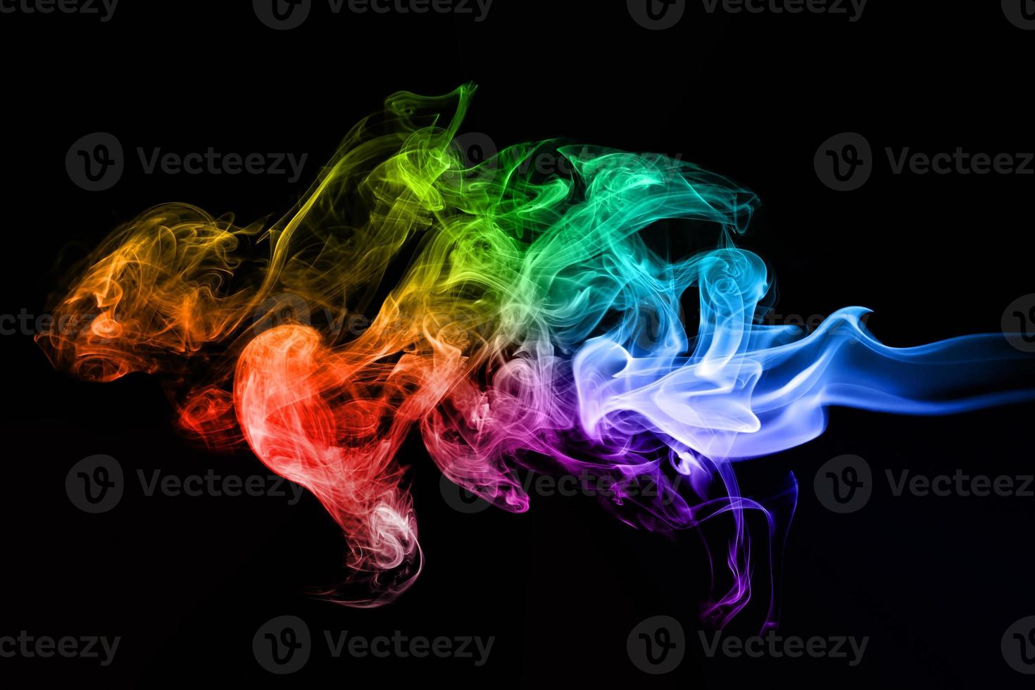 Colorful creative smoke waves on black background photo