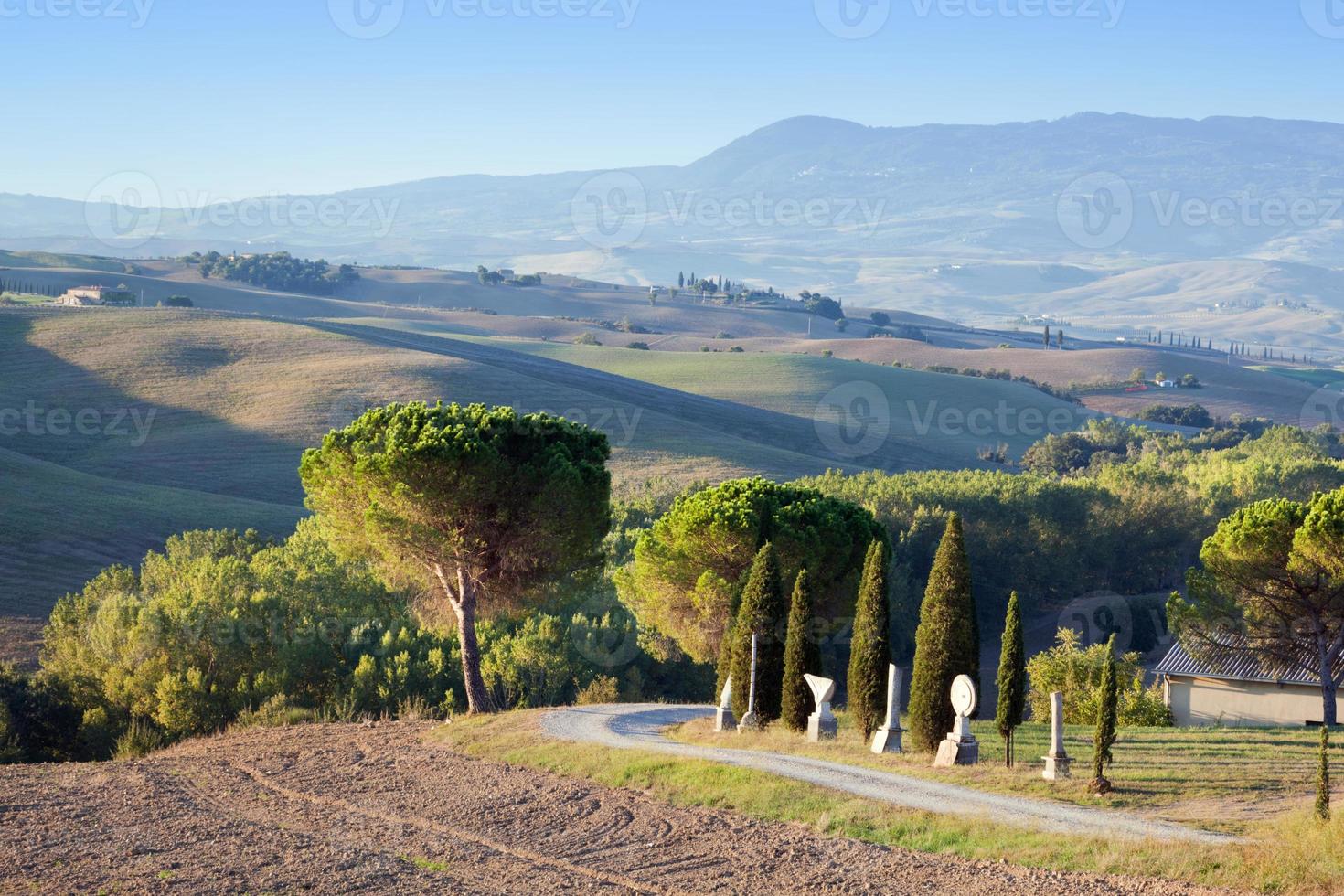 Tuscany landscape in the morning. Tuscan farms, hills, cypress trees photo