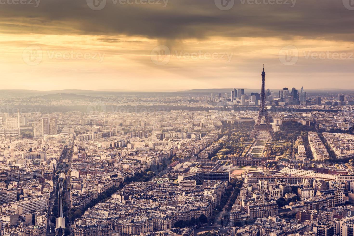 Paris, France skyline at sunset. Eiffel Tower in romantic golden light photo