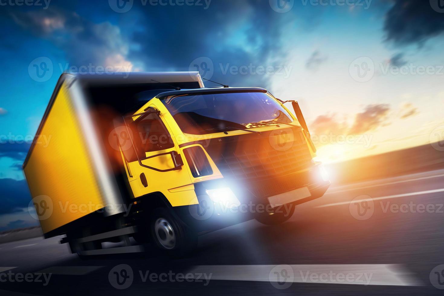 Commercial cargo delivery truck with trailer driving on highway at sunset. photo