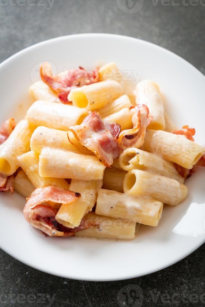 spaghetti rigatoni pasta with white sauce and bacon 7799851 Stock Photo