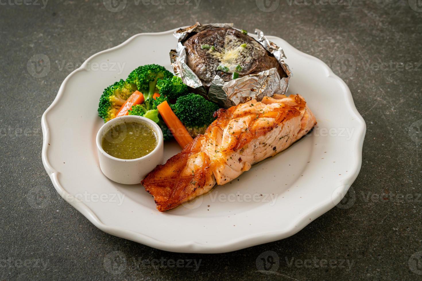 grilled salmon steak with bake potato photo