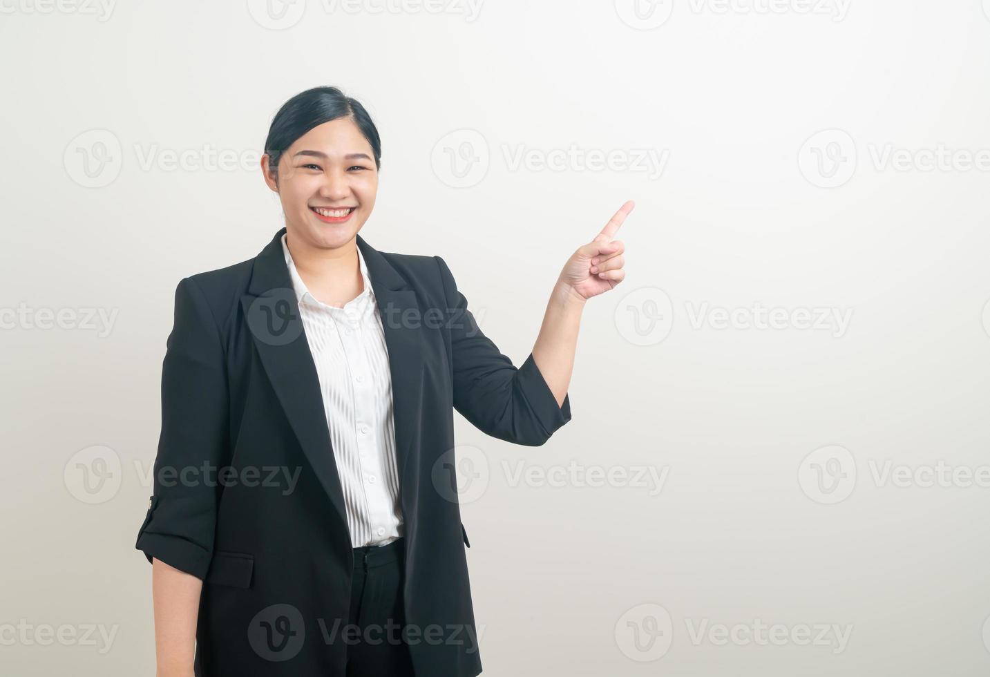 Asian woman with hand pointing on white background photo