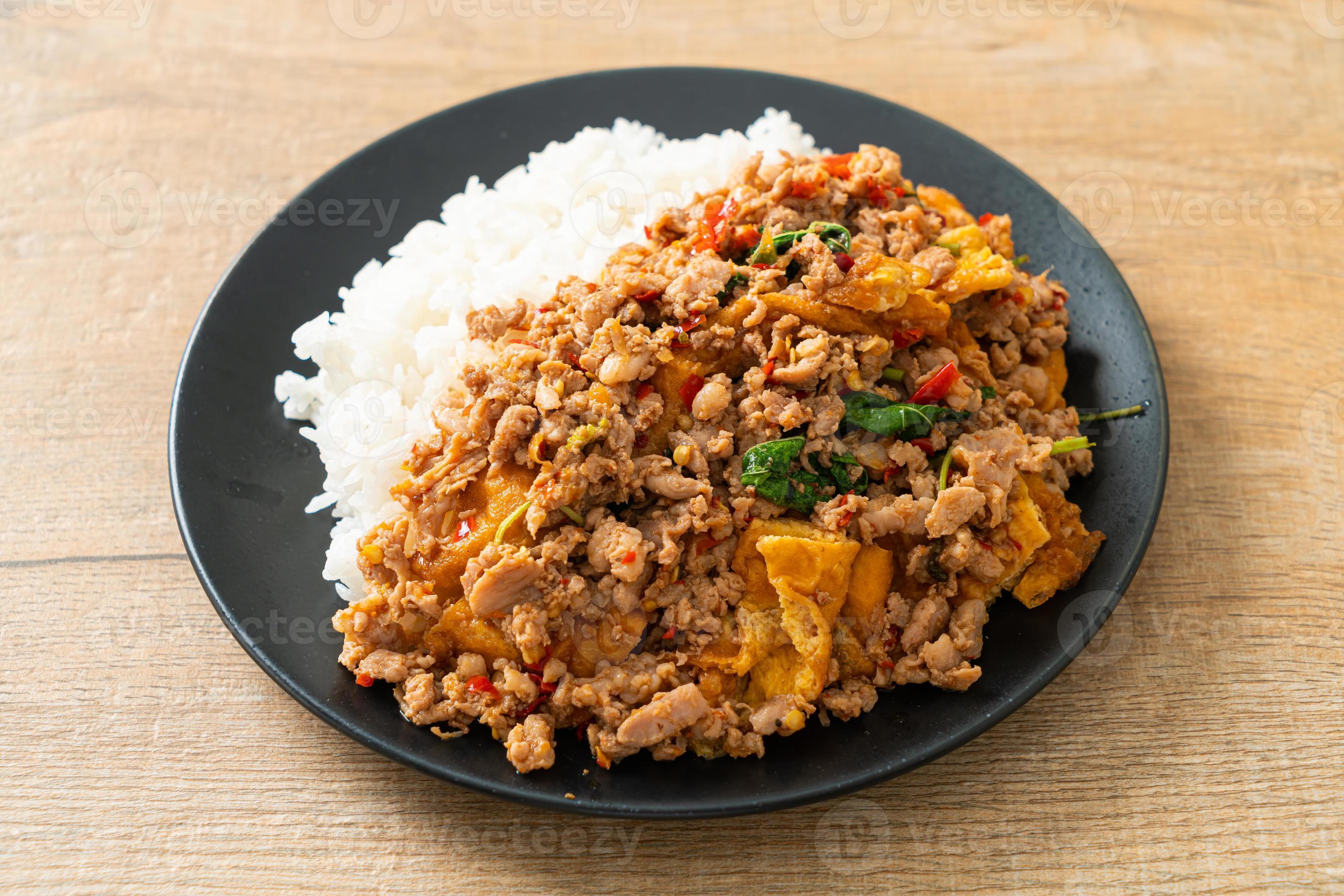 stirfried minced pork with basil and egg topped on rice 7800302 Stock